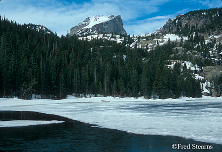 Rocky Mountain NP Hallett Peak over a Thawing Bear Lake